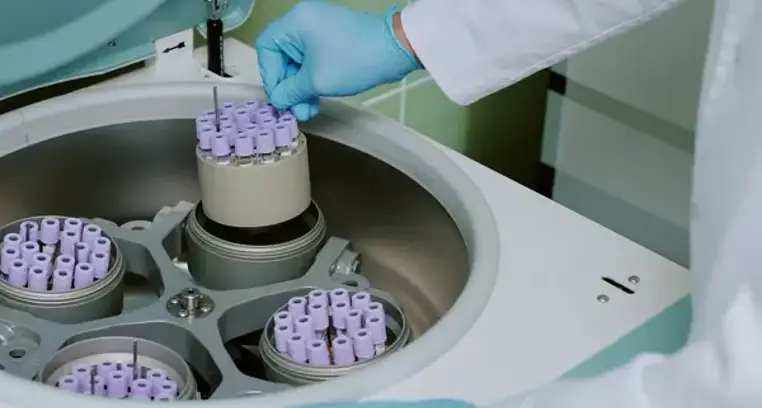 Operating modern laboratory centrifuge – representing research and medical applications supported by Noblegen liquid nitrogen generators